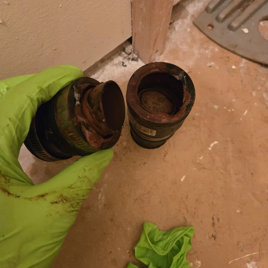 Corroded sump pump check valve showing rust and deterioration in Mississauga basement