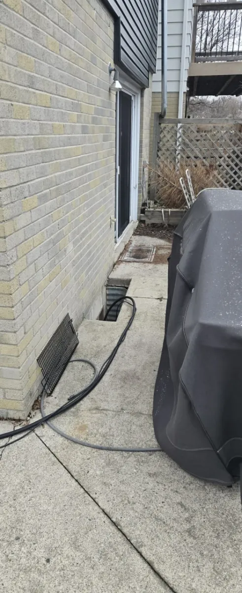 Exterior sump pump discharge pipe and foundation drainage in Newmarket