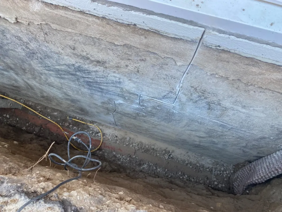 Foundation wall preparation and cleaning during Barrie exterior waterproofing project