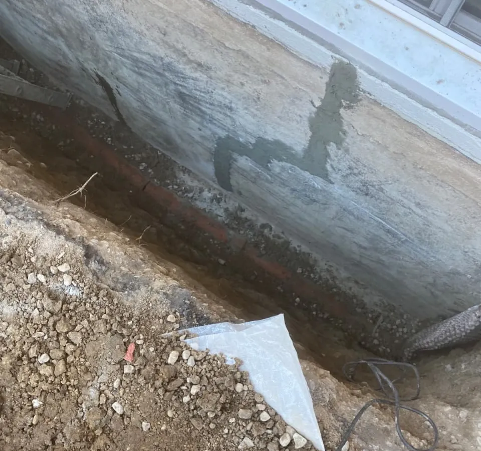 Professional waterproofing membrane application on Barrie rental property foundation