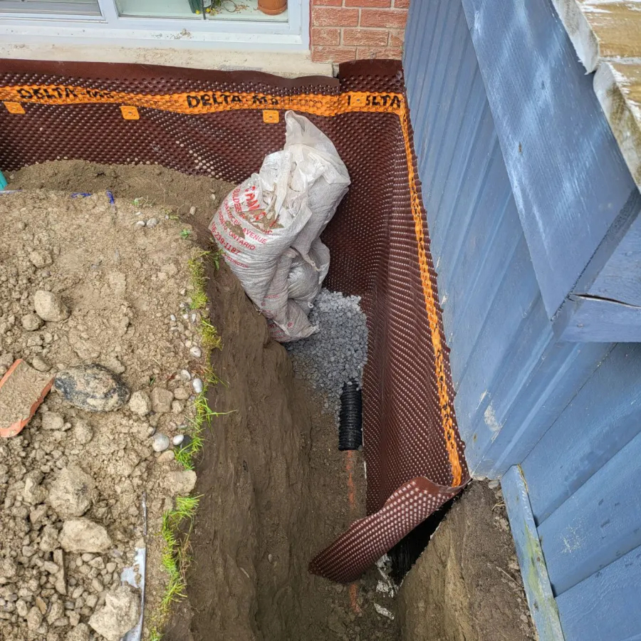Foundation wall preparation and cleaning for waterproofing in Bradford