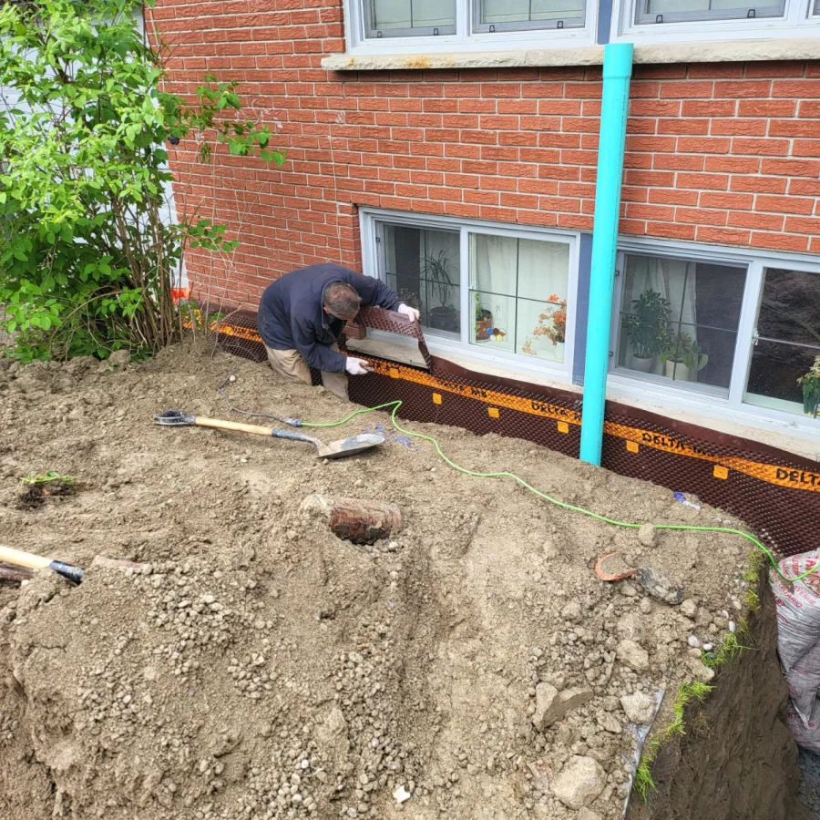 Professional excavation for exterior waterproofing in Bradford home
