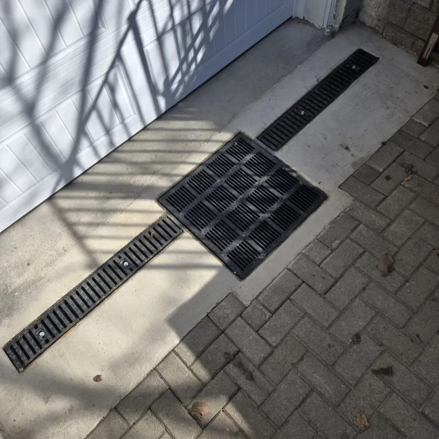 Completed garage trench drain installation in North York home