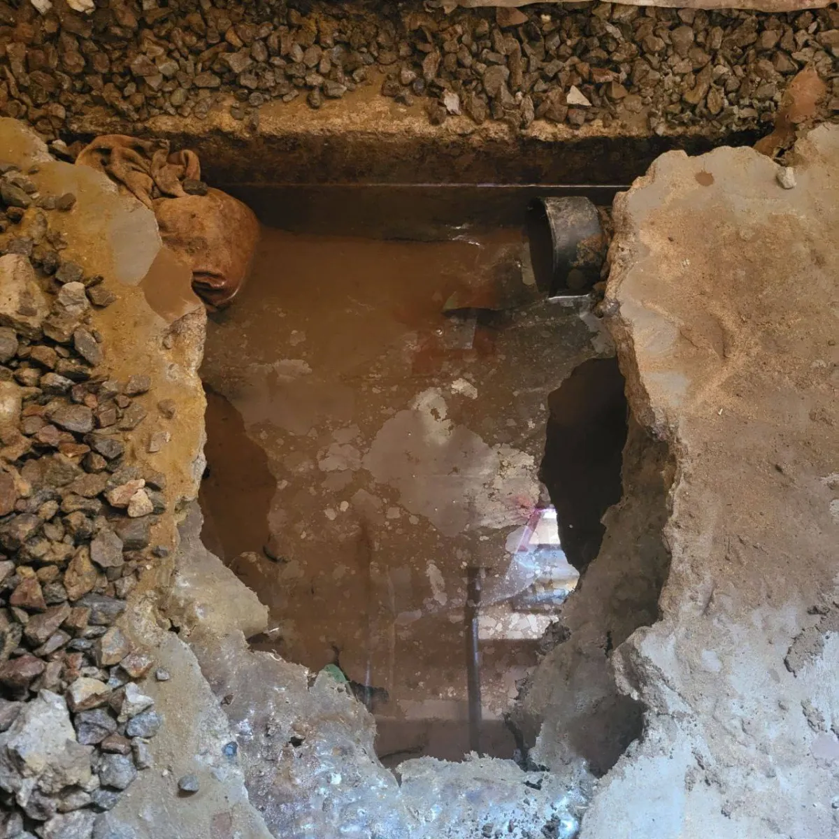 Deep excavation exposing foundation wall for waterproofing in Mount Albert