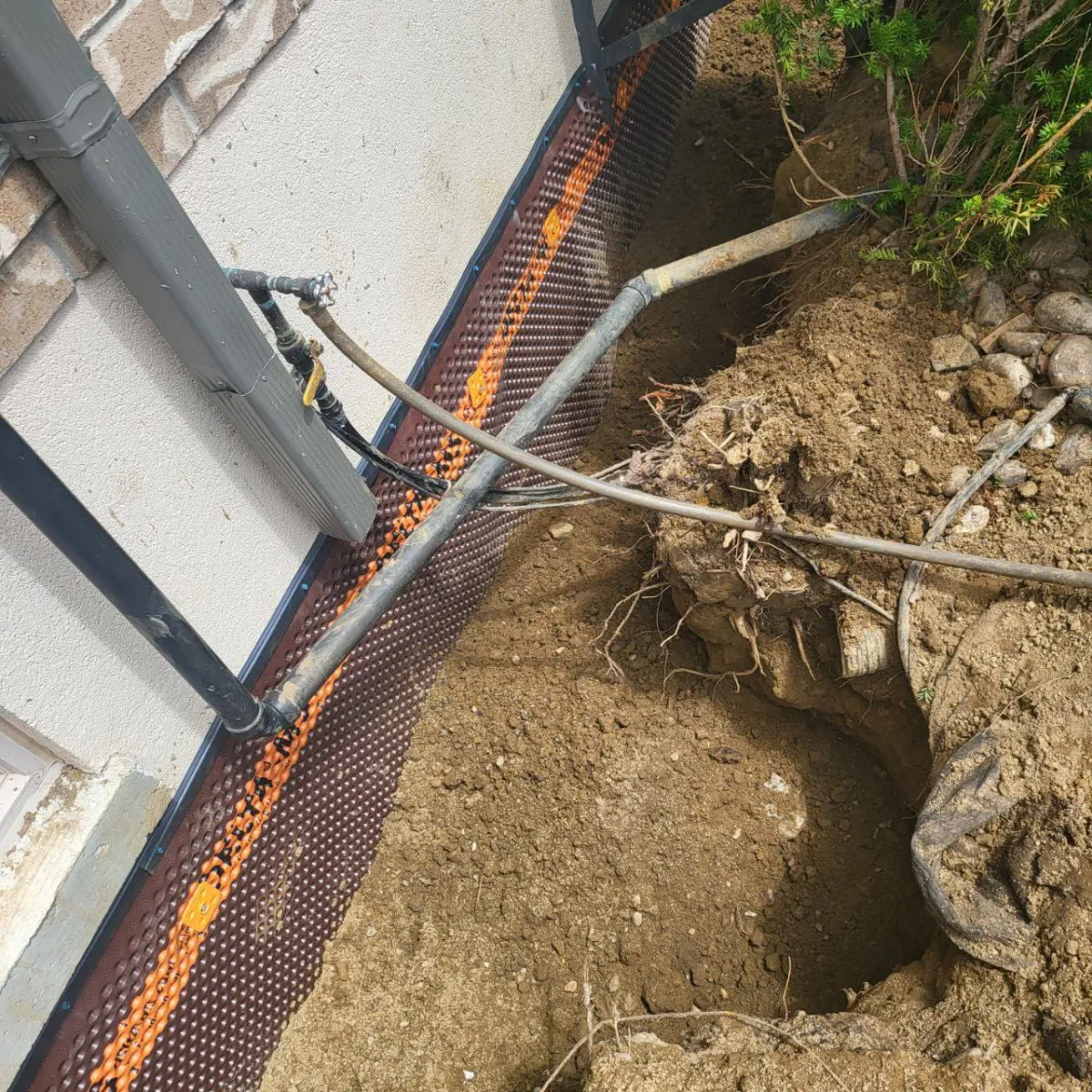 Foundation excavation work at Mount Albert residential exterior waterproofing project