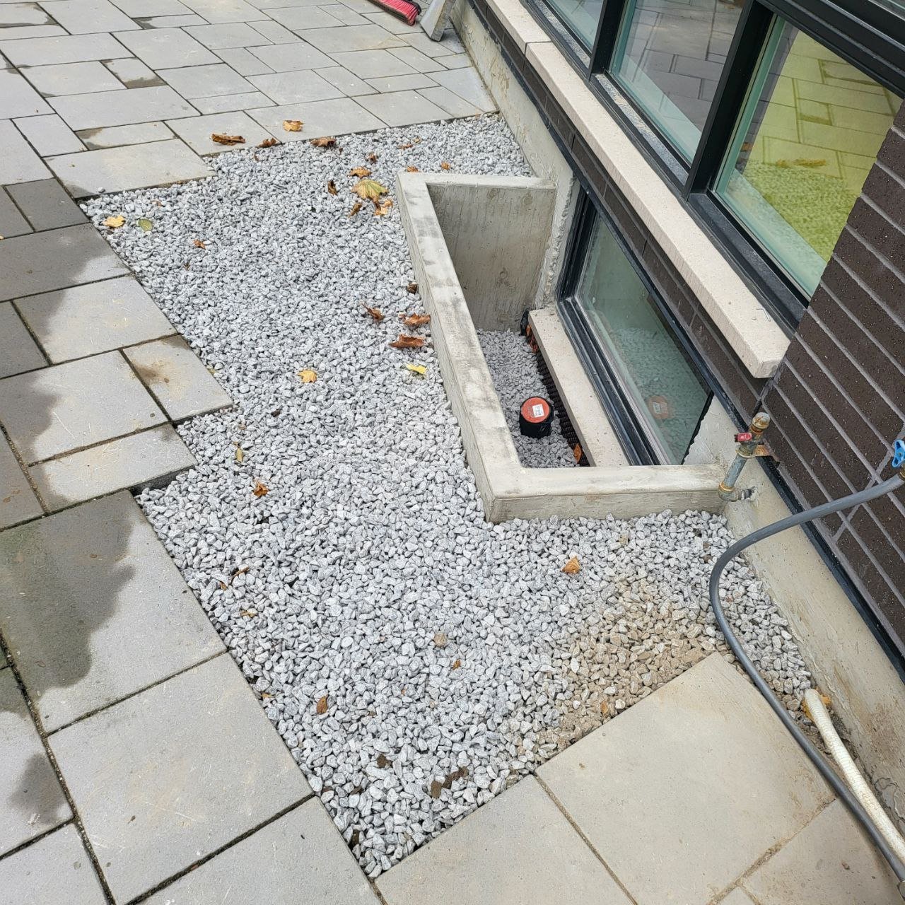 Concrete window well installed at North York home — front view