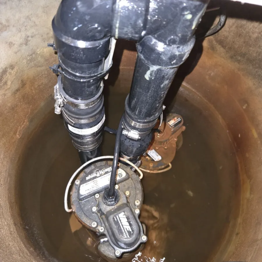 Leaking sump pump check valve with water damage in basement